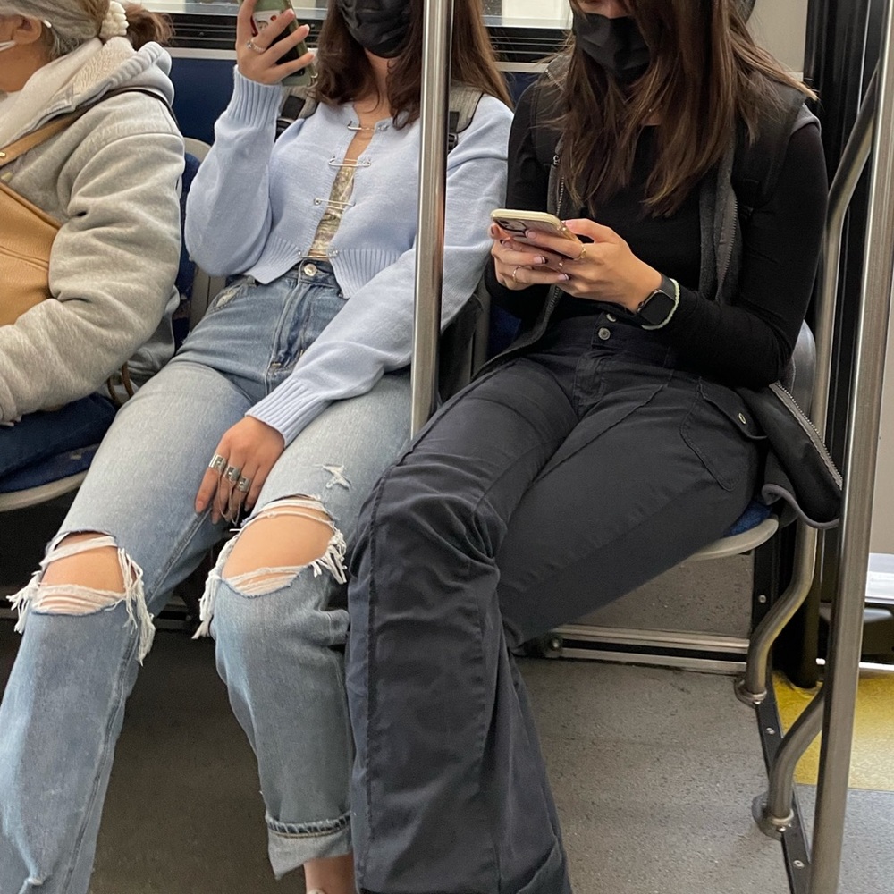 Light blue sweater with silver pins